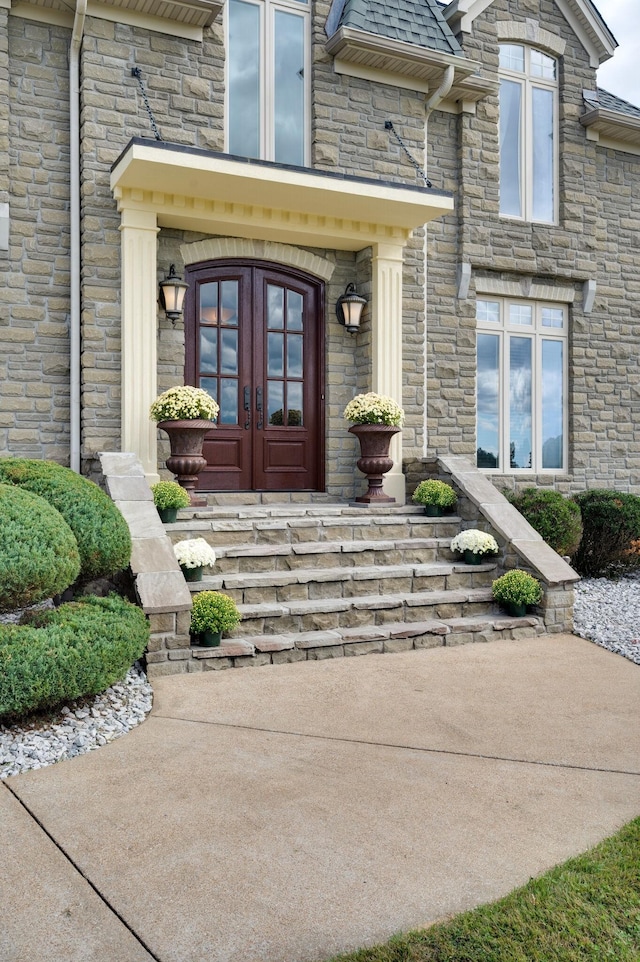 property entrance featuring french doors