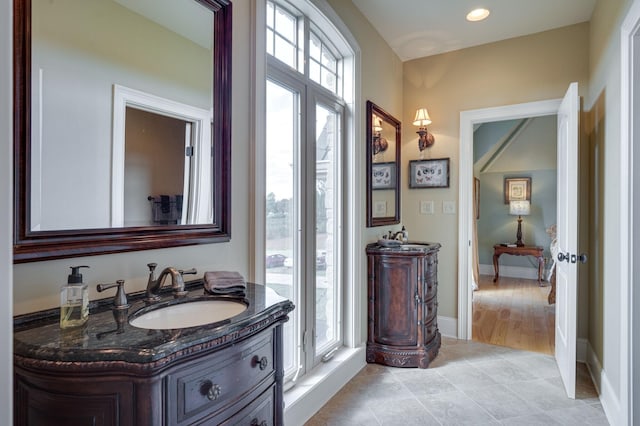 bathroom with vanity and a wealth of natural light