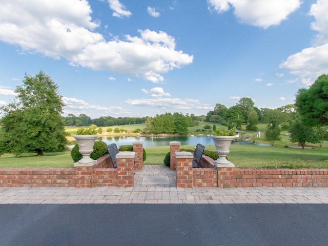 view of patio / terrace with a water view