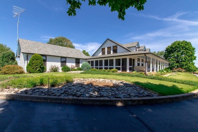 view of front facade featuring a sunroom