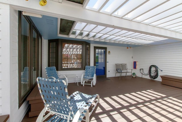 view of patio featuring a pergola and a wooden deck