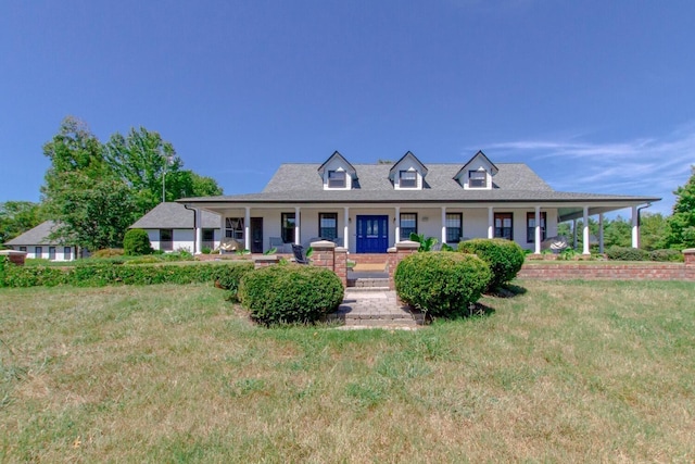 cape cod house featuring covered porch and a front lawn