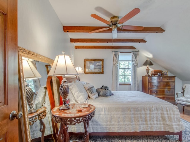 bedroom with ceiling fan and lofted ceiling with beams