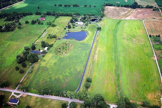 drone / aerial view featuring a rural view and a water view