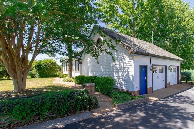 view of home's exterior with a garage