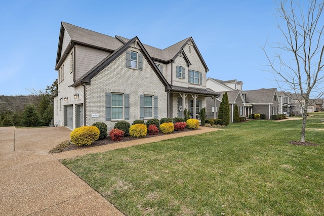 view of front facade with a garage and a front lawn