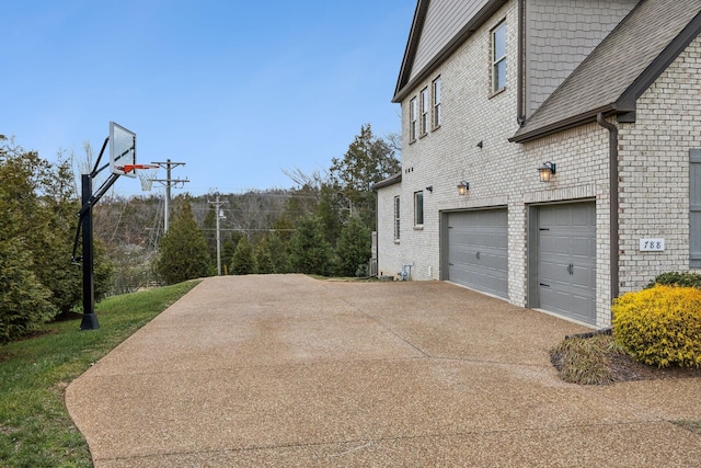 view of side of home featuring a garage