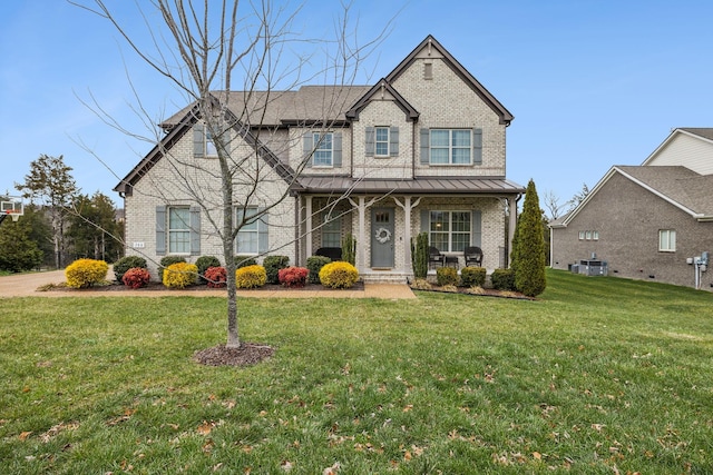 view of front of house with a porch, cooling unit, and a front yard