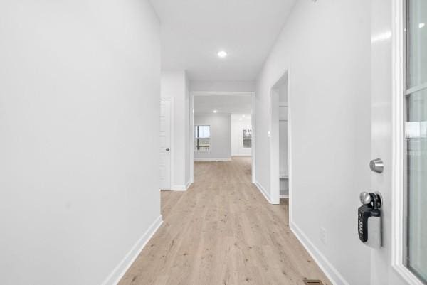 hall with light wood-type flooring