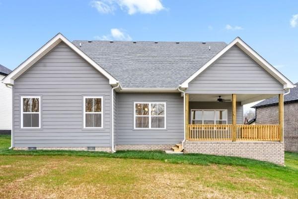 back of house featuring a yard and ceiling fan