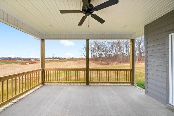 exterior space with ceiling fan and a rural view