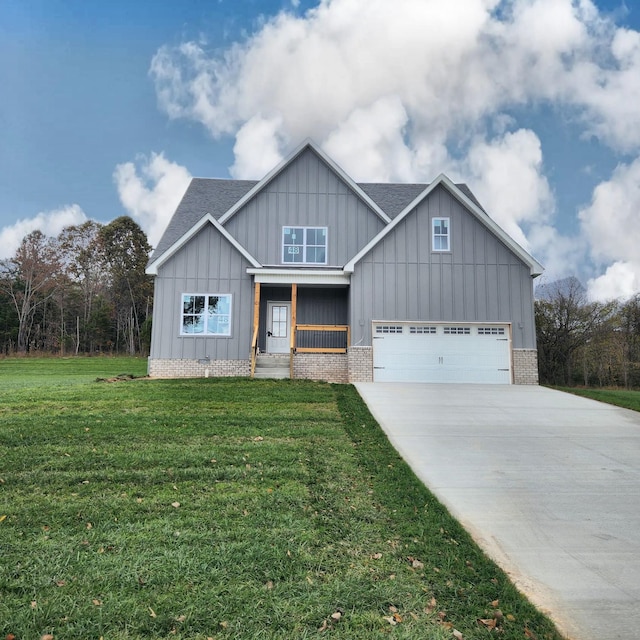 view of front of home featuring a garage and a front yard