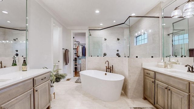 bathroom with vanity, separate shower and tub, ornamental molding, and tile walls