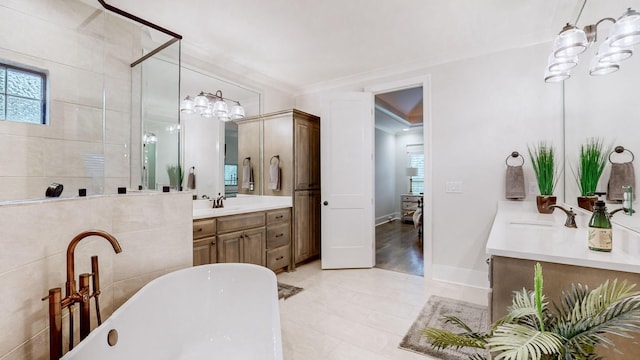 bathroom featuring vanity, shower with separate bathtub, and crown molding