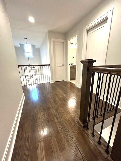 corridor featuring dark hardwood / wood-style flooring