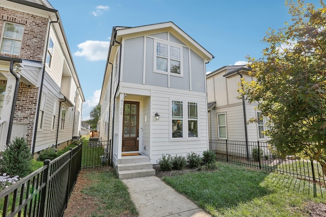 view of front of property with a front lawn