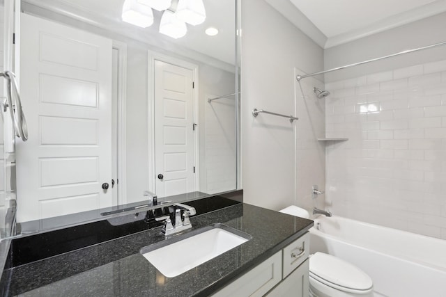 full bathroom featuring vanity, toilet, crown molding, and bathing tub / shower combination