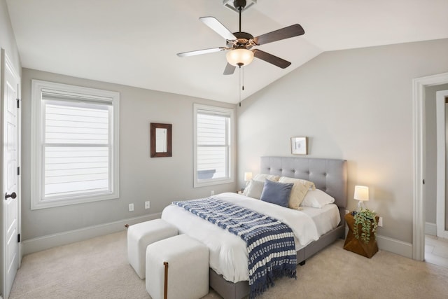 carpeted bedroom featuring ceiling fan and vaulted ceiling