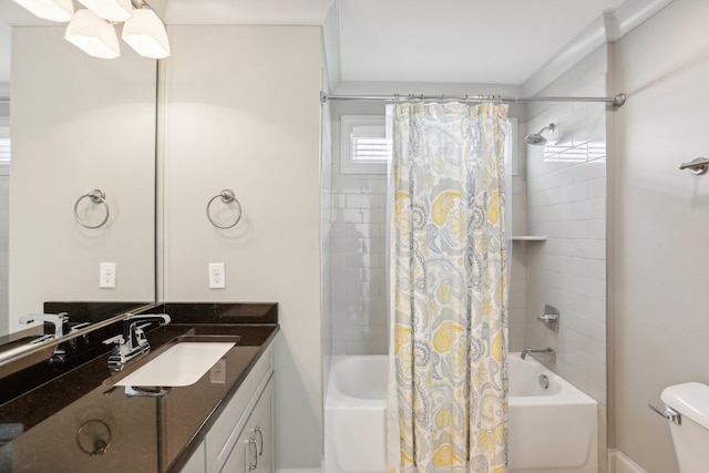 full bathroom featuring crown molding, shower / tub combo with curtain, vanity, and toilet