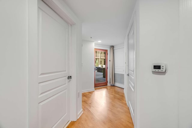 hall with light wood-type flooring