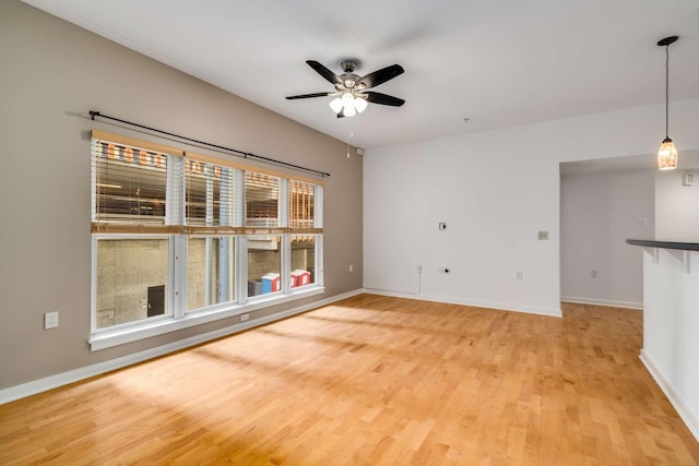 spare room with ceiling fan and light hardwood / wood-style floors