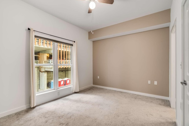 carpeted empty room with ceiling fan