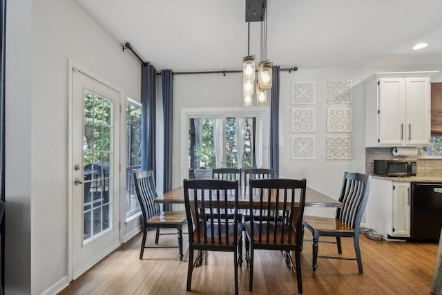 dining area with light hardwood / wood-style floors