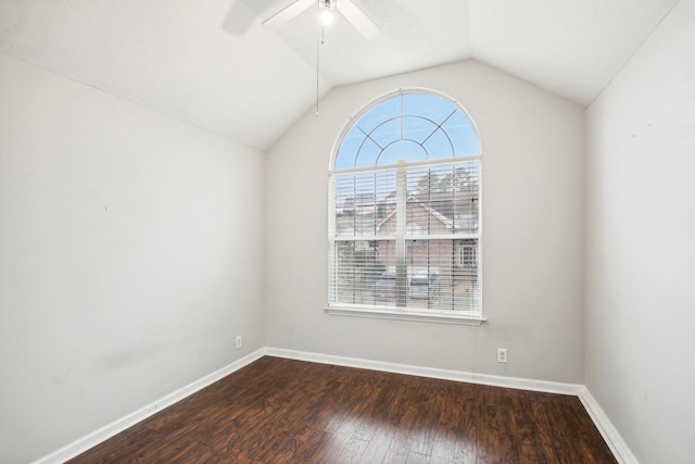 spare room featuring ceiling fan, dark hardwood / wood-style floors, and lofted ceiling