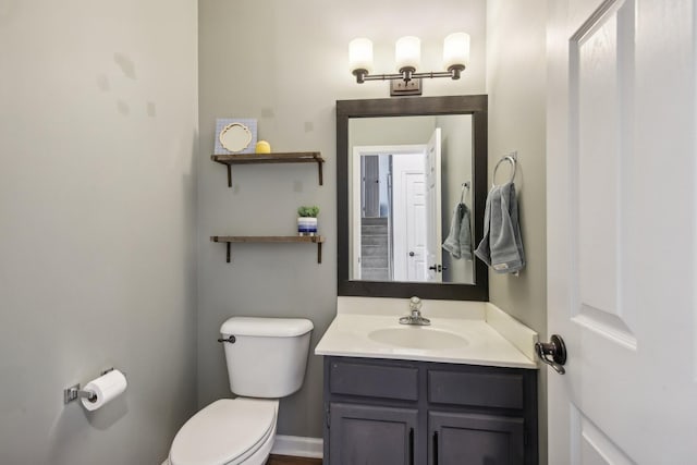 bathroom featuring vanity and toilet