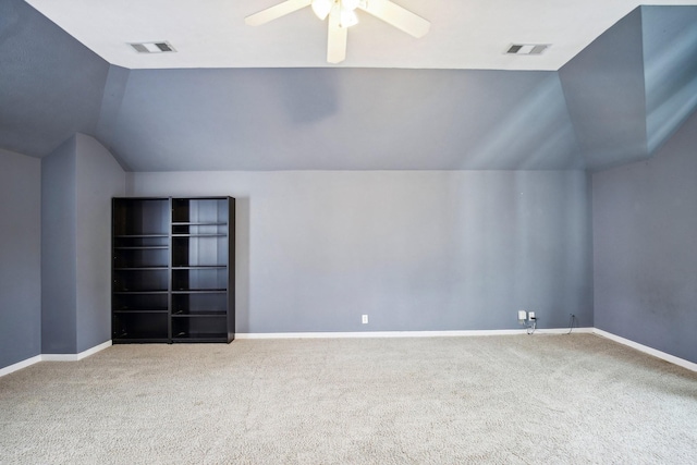 additional living space featuring carpet, ceiling fan, and lofted ceiling