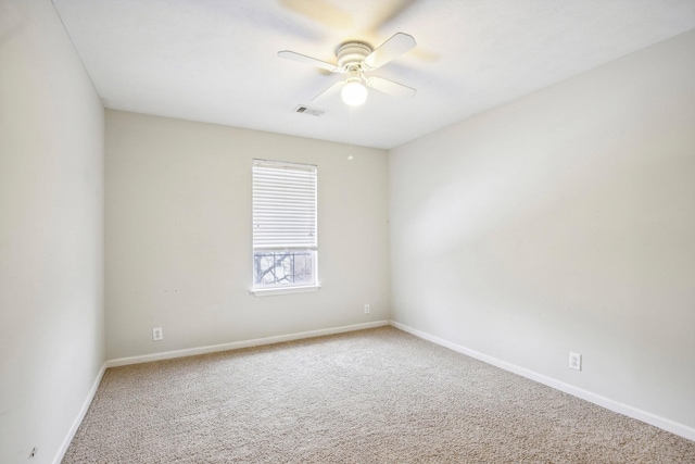 spare room with ceiling fan and carpet floors