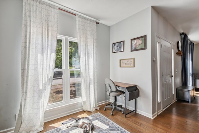 office with dark wood-type flooring