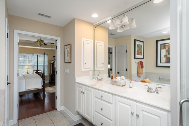 bathroom featuring tile patterned floors, vanity, and ceiling fan