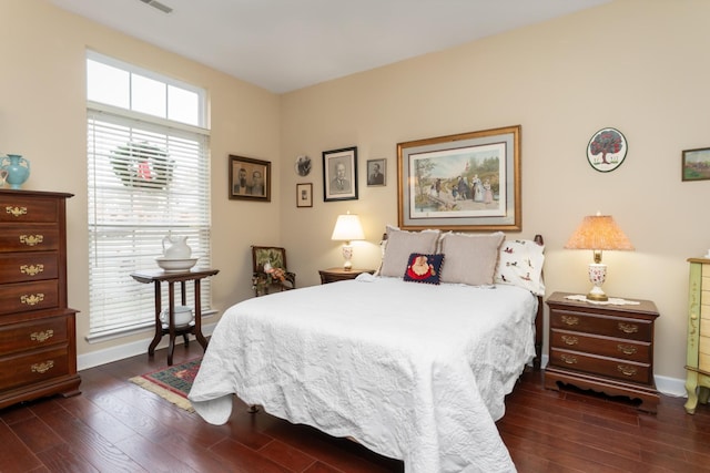 bedroom featuring dark wood-type flooring