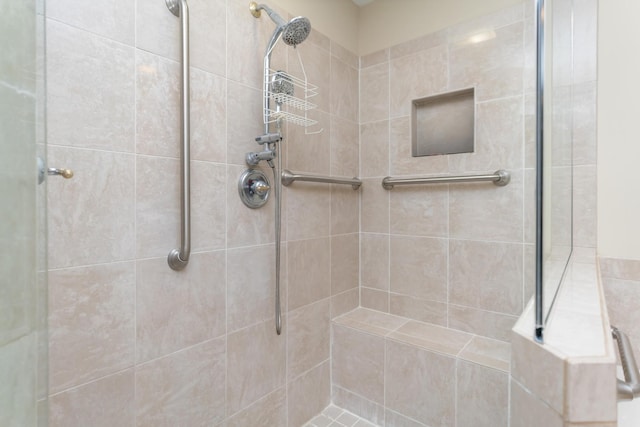 bathroom with tiled shower