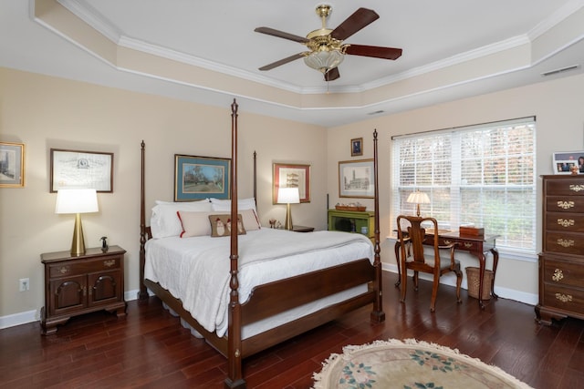 bedroom with a raised ceiling, ceiling fan, and ornamental molding