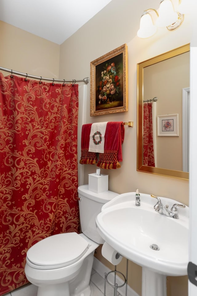 bathroom featuring toilet and sink