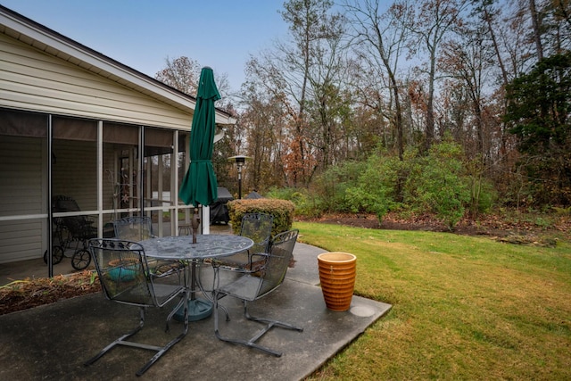 view of patio featuring a sunroom