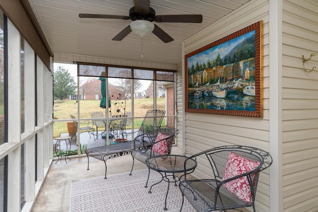 sunroom / solarium with ceiling fan and a healthy amount of sunlight