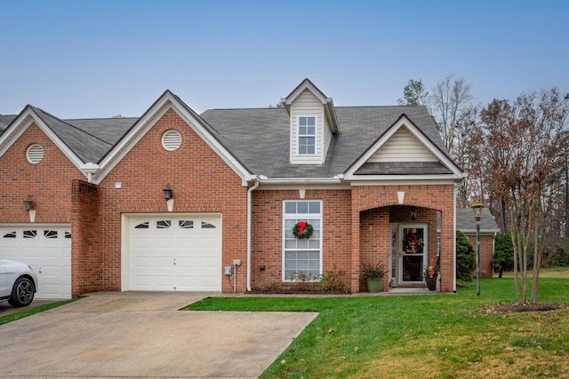 view of front of property featuring a garage and a front lawn