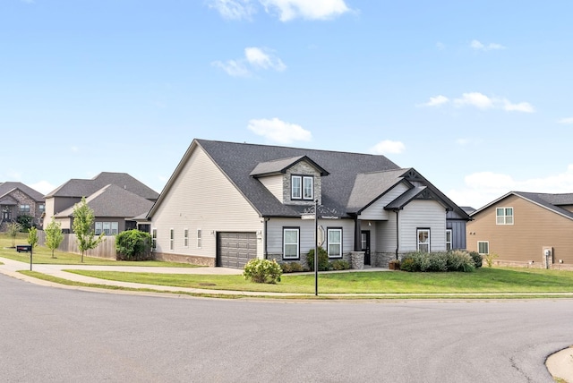 view of front facade with a front yard and a garage