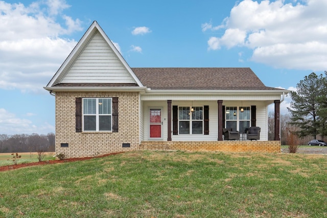 view of front of home with covered porch and a front lawn