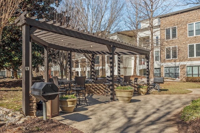 view of community featuring a pergola and a patio