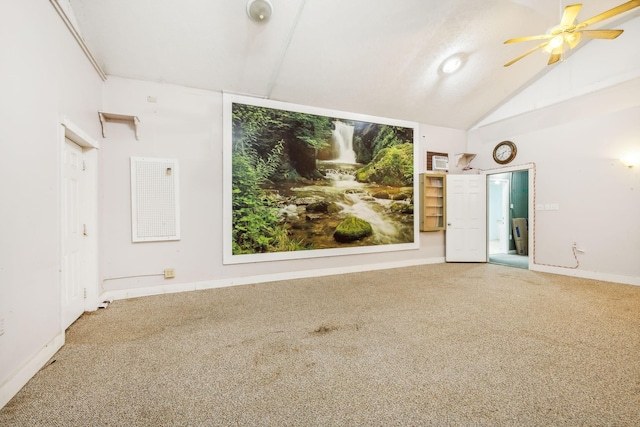 spare room with carpet, ceiling fan, and lofted ceiling