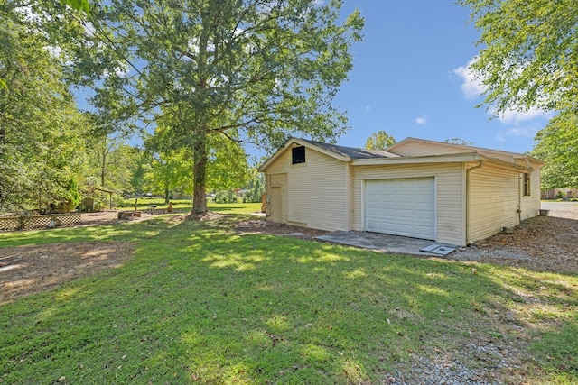 garage with a yard