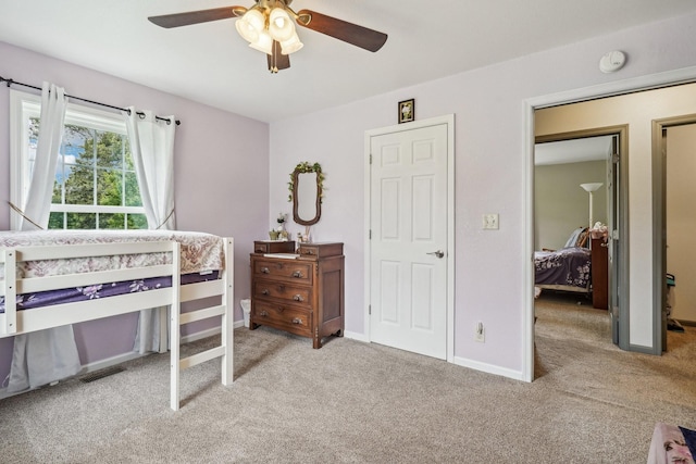 carpeted bedroom featuring ceiling fan