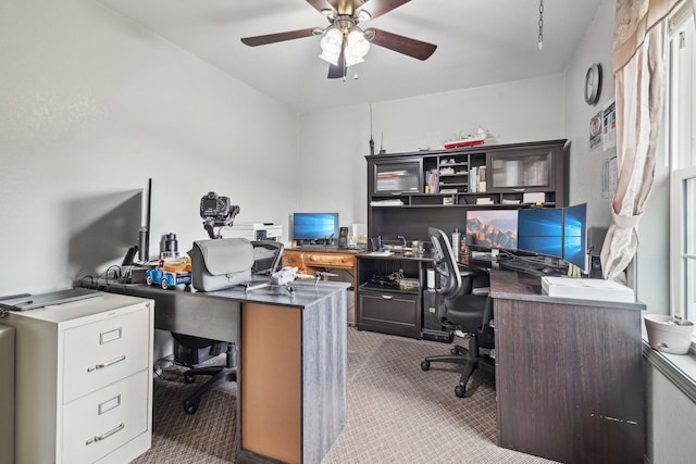 carpeted home office with ceiling fan