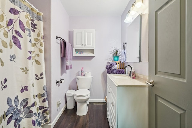 bathroom with a shower with shower curtain, vanity, toilet, and wood-type flooring