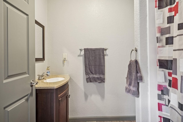 bathroom with vanity and walk in shower