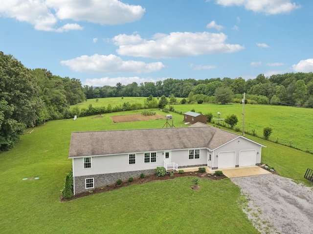 birds eye view of property with a rural view